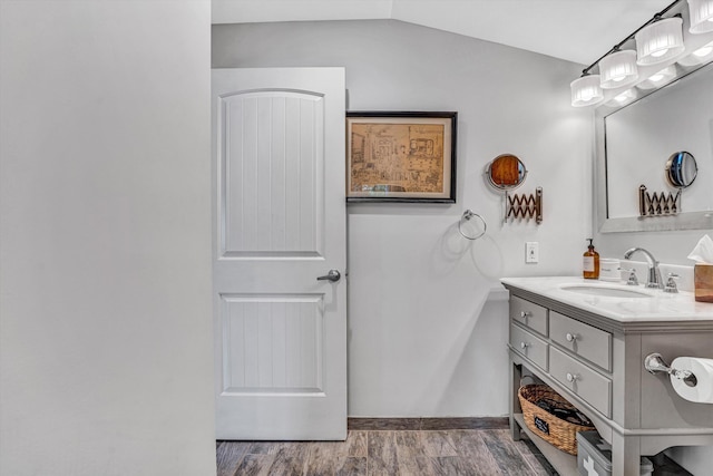 511 Autumn Ave, Huddleston, VA 24104 - bathroom featuring vanity, lofted ceiling, and baseboards