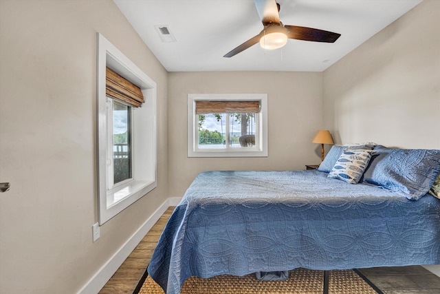 511 Autumn Ave, Huddleston, VA 24104 - bedroom with wood finished floors, baseboards, and a ceiling fan