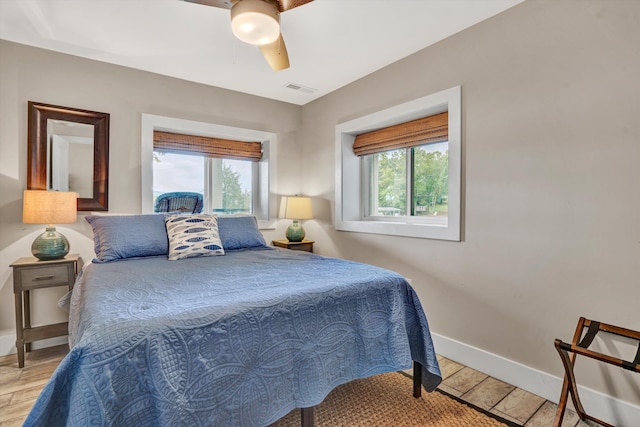 511 Autumn Ave, Huddleston, VA 24104 - bedroom with baseboards, a ceiling fan, and light wood-style flooring