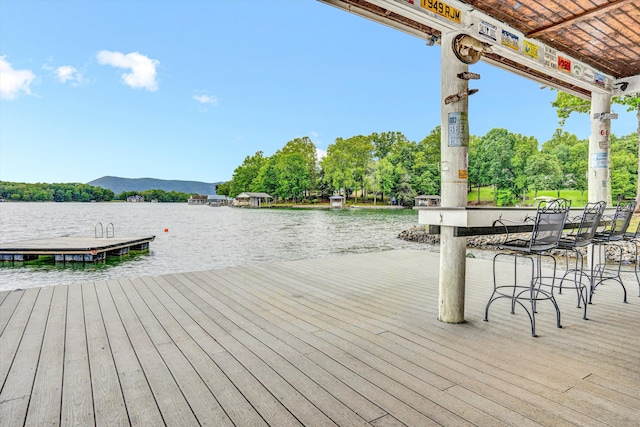 511 Autumn Ave, Huddleston, VA 24104 - wooden terrace featuring a water view, a floating dock, and view of wooded area