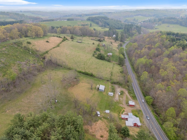 birds eye view of property with a rural view