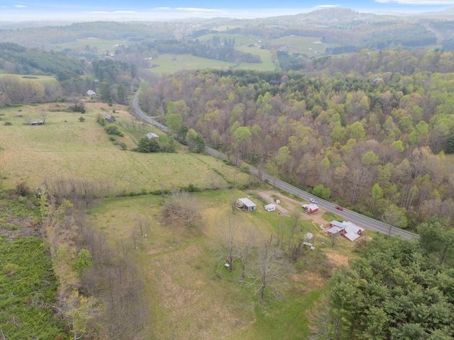 drone / aerial view with a rural view and a wooded view