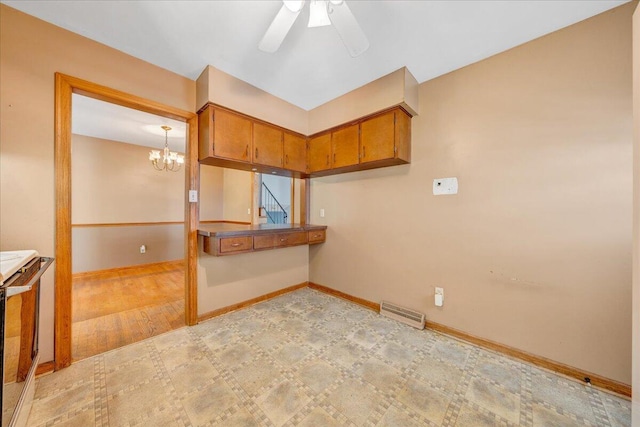 interior space featuring visible vents, baseboards, ceiling fan with notable chandelier, and light wood-style floors