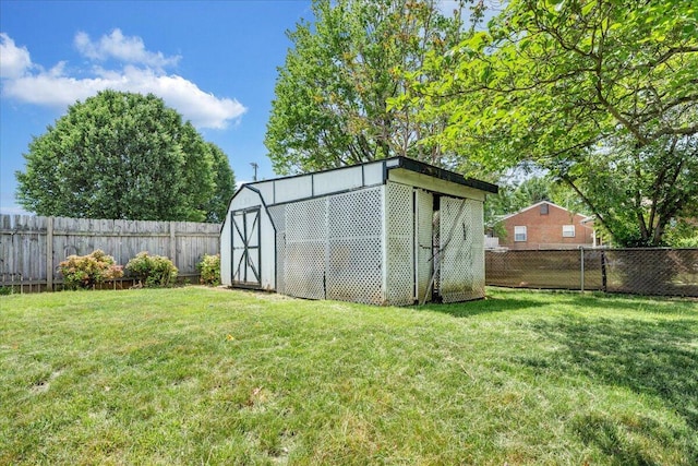 view of shed featuring a fenced backyard