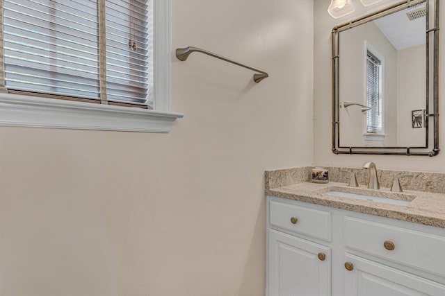 bathroom featuring visible vents and vanity