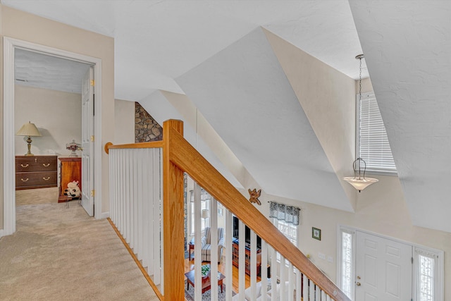corridor with baseboards and carpet