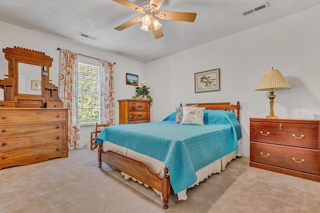 bedroom with ceiling fan, carpet, and visible vents