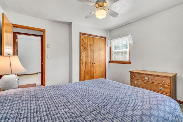 bedroom featuring a ceiling fan, baseboards, and a closet