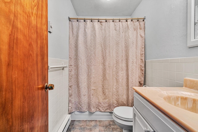 bathroom with wainscoting, vanity, toilet, tile walls, and a baseboard radiator