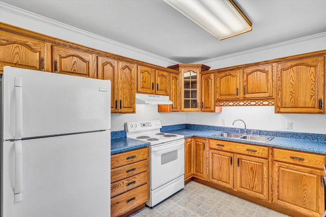 kitchen with a sink, under cabinet range hood, brown cabinets, and white appliances