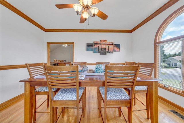 1165 Joffrey Dr, Huddleston, VA 24104 - dining area featuring a ceiling fan, wood finished floors, crown molding, and baseboards