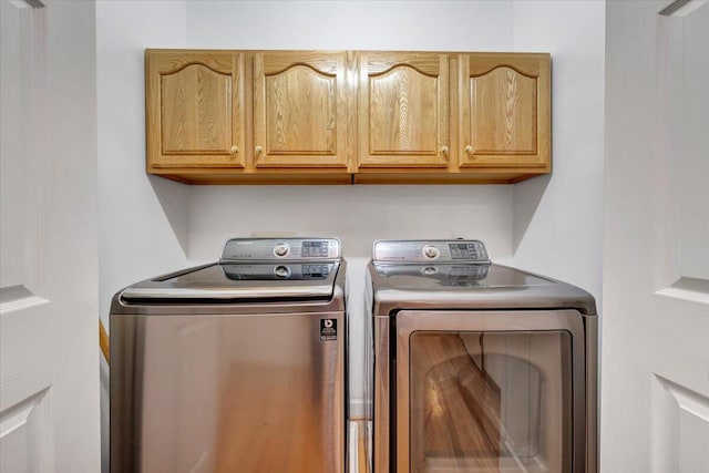 1165 Joffrey Dr, Huddleston, VA 24104 - washroom with cabinet space and washer and clothes dryer