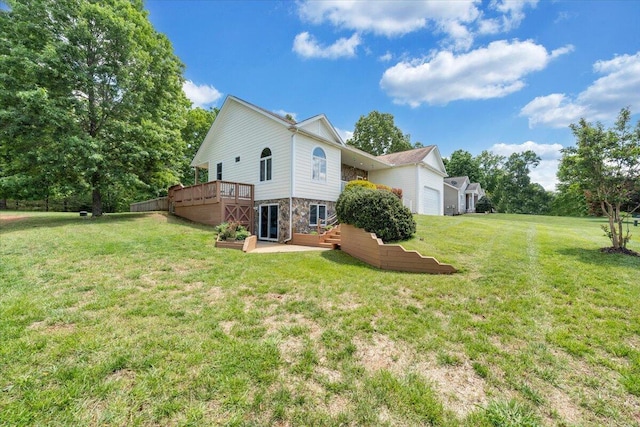 1165 Joffrey Dr, Huddleston, VA 24104 - back of property with stone siding, a lawn, an attached garage, and a wooden deck