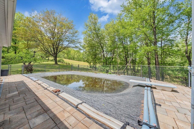 back of house featuring a fenced backyard, a gate, a mountain view, a chimney, and a patio area