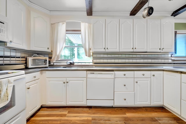 kitchen featuring beam ceiling, white cabinets, a sink, light wood finished floors, and dishwasher