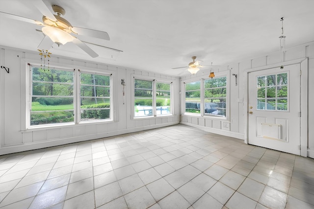 carpeted living area featuring wood walls