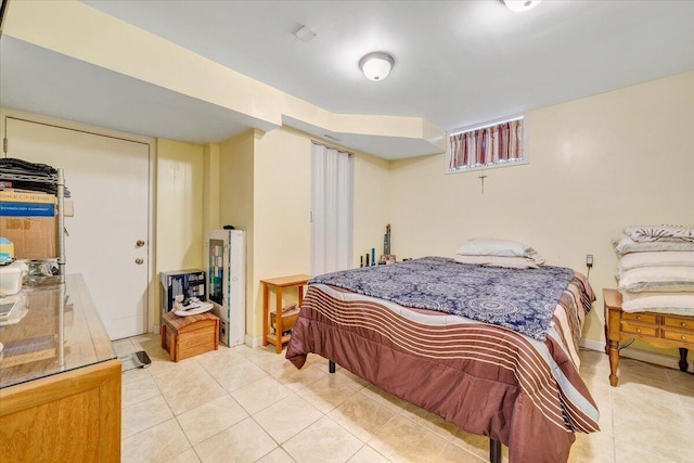 bedroom with light tile patterned floors