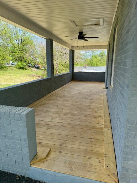 wooden deck with ceiling fan