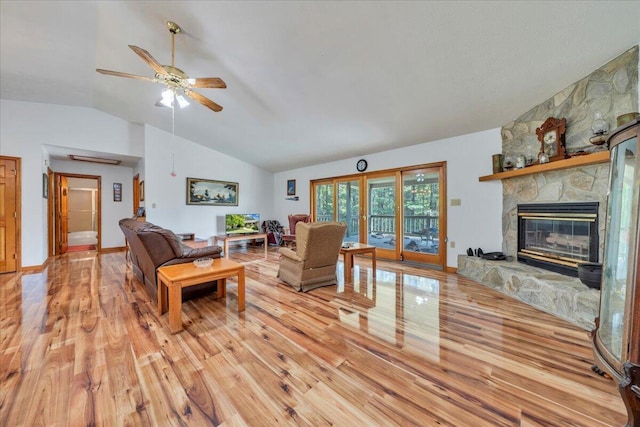 1296 Emerald Valley Way, Huddleston, VA 24104 - living area with lofted ceiling, light wood-style flooring, ceiling fan, and a fireplace