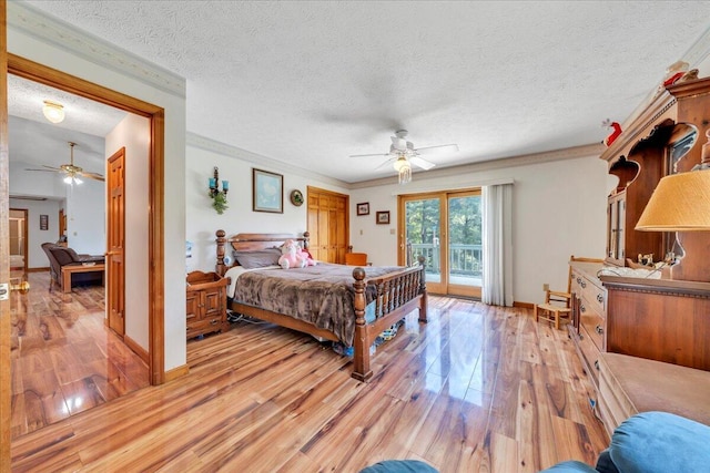 1296 Emerald Valley Way, Huddleston, VA 24104 - bedroom featuring access to exterior, light wood-type flooring, a textured ceiling, crown molding, and baseboards