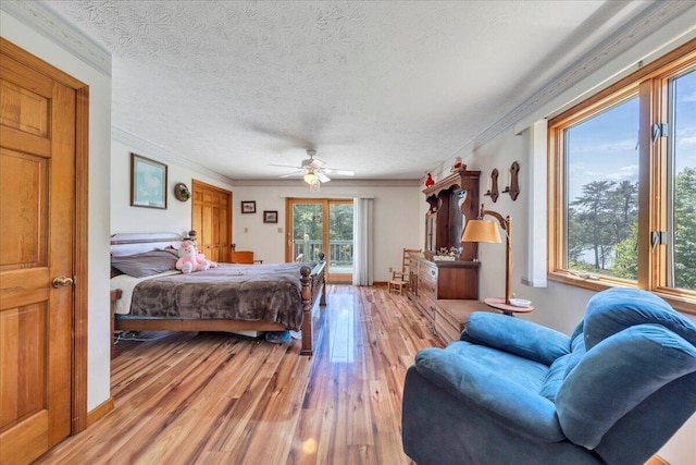 1296 Emerald Valley Way, Huddleston, VA 24104 - bedroom with light wood-style floors, crown molding, a textured ceiling, and ceiling fan