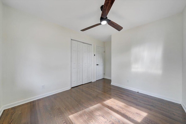unfurnished bedroom featuring baseboards, ceiling fan, and wood finished floors