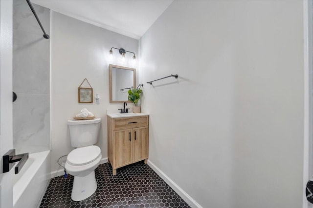 full bathroom featuring toilet, baseboards, tub / shower combination, and vanity