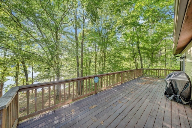 wooden deck featuring area for grilling