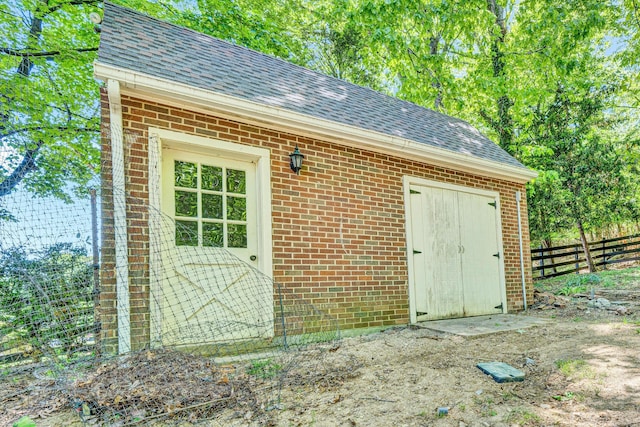 view of outdoor structure featuring fence