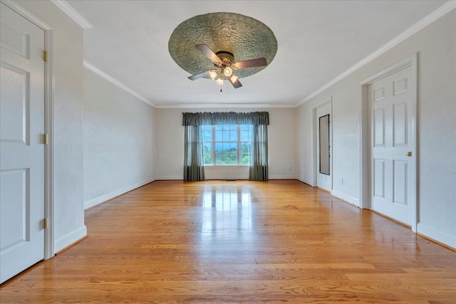 unfurnished bedroom with a ceiling fan, baseboards, ornamental molding, and wood finished floors