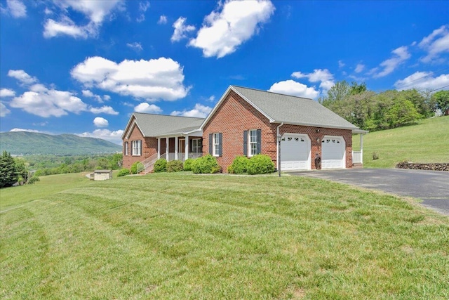view of home's exterior with an attached garage, a yard, aphalt driveway, and brick siding