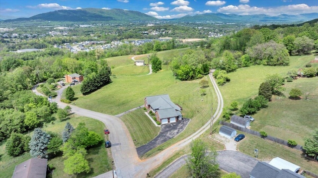 birds eye view of property with a mountain view