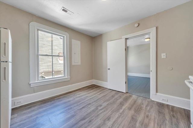 1012 Loudon Ave NW, Roanoke, VA 24016 - spare room with baseboards, wood finished floors, and visible vents