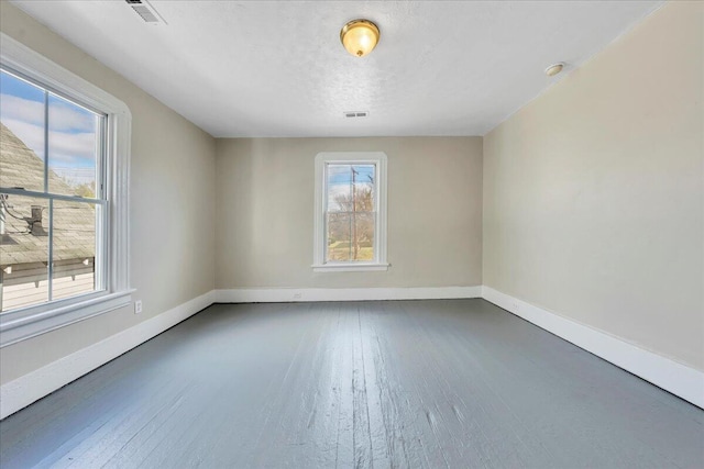 1012 Loudon Ave NW, Roanoke, VA 24016 - spare room with baseboards, wood finished floors, and visible vents
