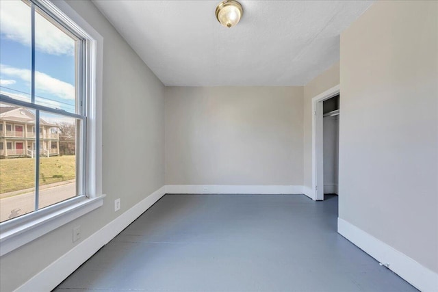1012 Loudon Ave NW, Roanoke, VA 24016 - bonus room with baseboards, a healthy amount of sunlight, and finished concrete floors