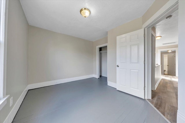 1012 Loudon Ave NW, Roanoke, VA 24016 - unfurnished bedroom with baseboards, visible vents, and a closet