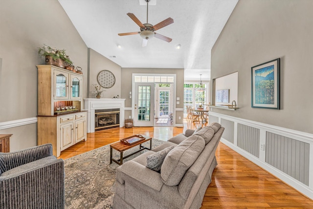 77 Sunview Cir, Moneta, VA 24121 - living room featuring a fireplace, ceiling fan, light wood finished floors, and high vaulted ceiling