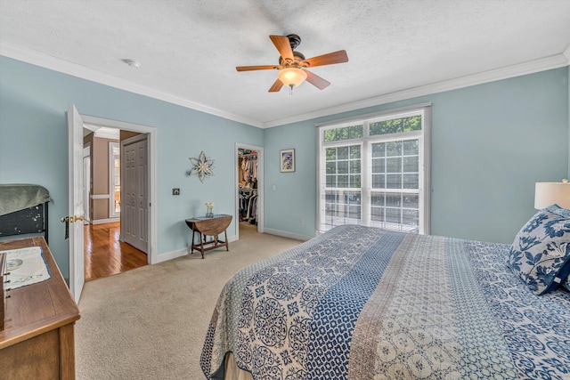 77 Sunview Cir, Moneta, VA 24121 - bedroom with ceiling fan, crown molding, baseboards, a spacious closet, and carpet flooring