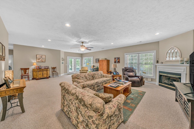 77 Sunview Cir, Moneta, VA 24121 - carpeted living area featuring a glass covered fireplace, plenty of natural light, and recessed lighting