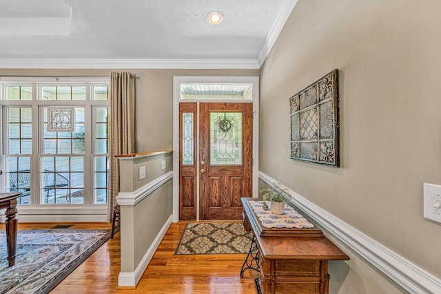 77 Sunview Cir, Moneta, VA 24121 - foyer featuring crown molding, baseboards, light wood finished floors, and visible vents