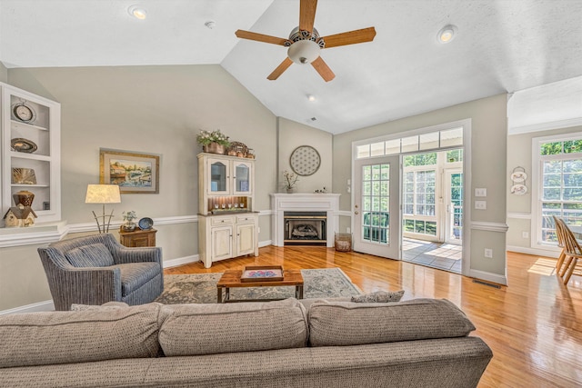 77 Sunview Cir, Moneta, VA 24121 - living room featuring a ceiling fan, baseboards, visible vents, and light wood-style flooring