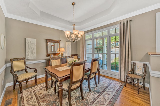 77 Sunview Cir, Moneta, VA 24121 - dining area with light wood finished floors, a raised ceiling, a chandelier, baseboards, and visible vents