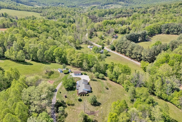 bird's eye view featuring a forest view