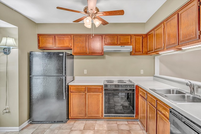 kitchen featuring freestanding refrigerator, range with electric stovetop, under cabinet range hood, a sink, and dishwasher