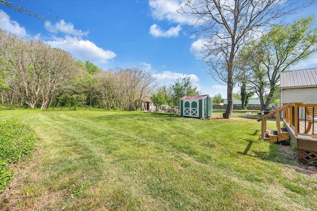 view of yard with an outbuilding and a storage unit