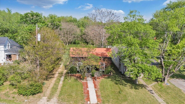 aerial view featuring a wooded view
