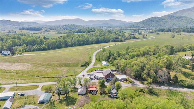 bird's eye view featuring a rural view and a mountain view