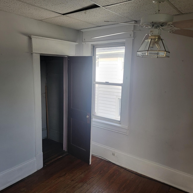 2118 Berkley Ave SW, Roanoke, VA 24015 - unfurnished bedroom with wood finished floors, a drop ceiling, baseboards, and a closet