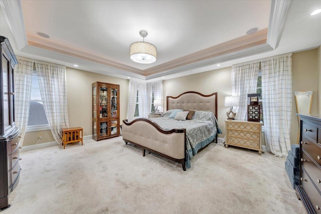 bedroom with a tray ceiling, ornamental molding, light colored carpet, baseboards, and recessed lighting