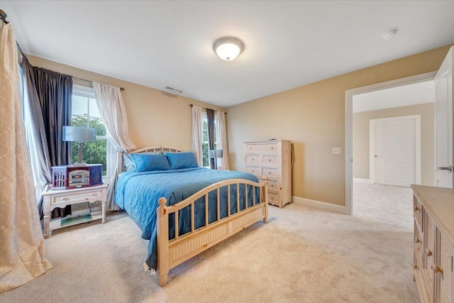 bedroom with carpet and baseboards